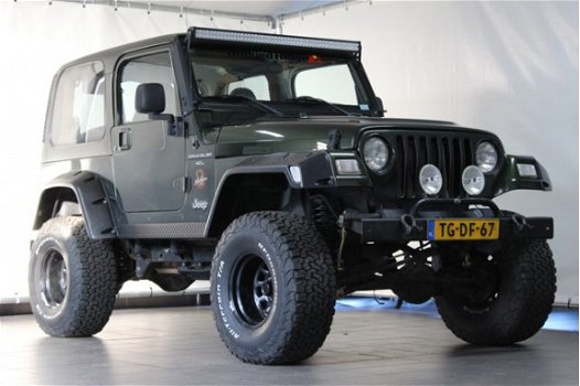 Jeep Wrangler - 4.0 I Sahara / LPG G3 / Youngtimer / Verhoogd - 1