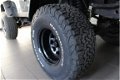 Jeep Wrangler - 4.0 I Sahara / LPG G3 / Youngtimer / Verhoogd - 1 - Thumbnail