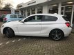 BMW 1-serie - 114i Upgrade Edition Org.NL|M|Navi groot|Sportstoelen|Parelmoer|Leer - 1 - Thumbnail