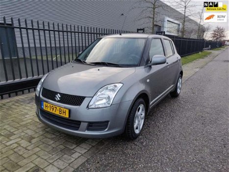 Suzuki Swift - 1.3 Comfort , 86125 km, AIRCO, CV met afst. bed., lichtmetalen velgen - 1