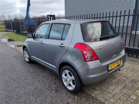 Suzuki Swift - 1.3 Comfort , 86125 km, AIRCO, CV met afst. bed., lichtmetalen velgen - 1