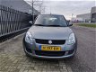 Suzuki Swift - 1.3 Comfort , 86125 km, AIRCO, CV met afst. bed., lichtmetalen velgen - 1 - Thumbnail