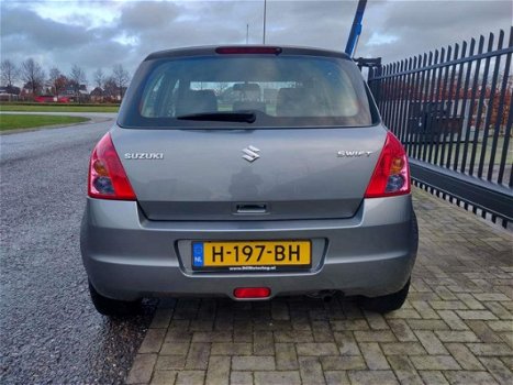 Suzuki Swift - 1.3 Comfort , 86125 km, AIRCO, CV met afst. bed., lichtmetalen velgen - 1