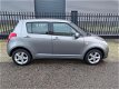 Suzuki Swift - 1.3 Comfort , 86125 km, AIRCO, CV met afst. bed., lichtmetalen velgen - 1 - Thumbnail