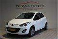 Mazda 2 - 2 1.3 Hanabi 2013/ Navi/ PDC/ Stuur bed./ Stoel verw./ Airco/ Elek ramen + Spiegels/ Boekj - 1 - Thumbnail