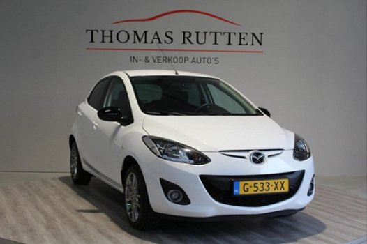 Mazda 2 - 2 1.3 Hanabi 2013/ Navi/ PDC/ Stuur bed./ Stoel verw./ Airco/ Elek ramen + Spiegels/ Boekj - 1