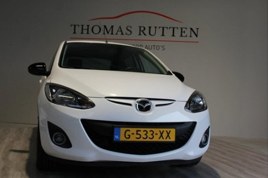 Mazda 2 - 2 1.3 Hanabi 2013/ Navi/ PDC/ Stuur bed./ Stoel verw./ Airco/ Elek ramen + Spiegels/ Boekj - 1