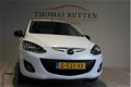 Mazda 2 - 2 1.3 Hanabi 2013/ Navi/ PDC/ Stuur bed./ Stoel verw./ Airco/ Elek ramen + Spiegels/ Boekj - 1 - Thumbnail