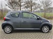 Toyota Aygo - 1.0-12V + - AIRCO - GRIJS - ELKE ZONDAG OPEN - 1 - Thumbnail