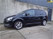 Volkswagen Touran - 1.2 TSI Comfortline BlueMotion LMV, airco - 1 - Thumbnail