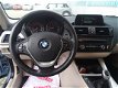 BMW 1-serie - 114i EDE Business+ - 1 - Thumbnail