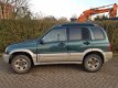 Suzuki Grand Vitara - 2.0 TDi Grijs Kenteken APK tm 31-05-2020 - 1 - Thumbnail