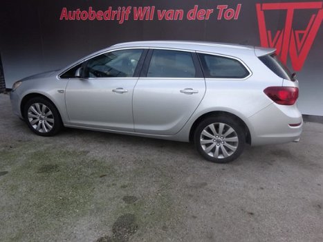 Opel Astra Sports Tourer - 1.4 TURBO SPORT | AUTOMAAT | NAVIGATIE | STUURVERW. | HALF-LEER | ALL-IN - 1