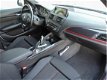 BMW 1-serie - 118i Business+ Aut. Navi Pro Xenon NL Auto Dealeronderhouden Sportstoelen Harman/Kardo - 1 - Thumbnail