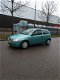 Opel Corsa - 1.2-16V Rhythm nieuwe APK - 1 - Thumbnail