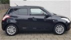 Suzuki Swift - 1.2 5drs exclusive clima cruise zeer mooi - 1 - Thumbnail