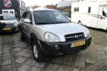 Hyundai Tucson - 2.0i 4WD Style Clima Cruise Trekhaak 141 pk NAP aanwezig - 1 - Thumbnail