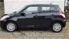 Suzuki Swift - 1.2 5 deurs comfort airco - 1 - Thumbnail