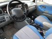 Suzuki Grand Vitara - 2.0i 4WD FreeStyle Airco Afn.trekhaak NL-auto - 1 - Thumbnail