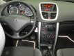 Peugeot 207 - 1.4 benzine * Airco * Trekhaak * Bluetooth * Cruise Control * Vingerhoets bladel: 995+ - 1 - Thumbnail