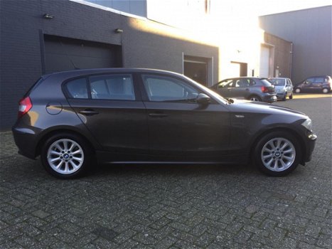 BMW 1-serie - 120i High Executive Aut. Clima Cruise LM-Wielen PDC APK NAP - 1