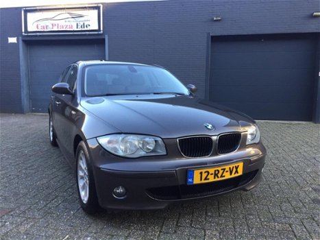 BMW 1-serie - 120i High Executive Aut. Clima Cruise LM-Wielen PDC APK NAP - 1