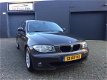 BMW 1-serie - 120i High Executive Aut. Clima Cruise LM-Wielen PDC APK NAP - 1 - Thumbnail