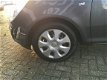 Opel Corsa - 1.4-16V Anniversary Edition - AIRCO - CRUISE CONTROL - ZEER LAGE KM-STAND - 1 - Thumbnail