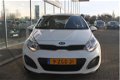 Kia Rio - 5D-COMFORT LINE-AIRCO-TREKHAAK-ELEKTR PAKKET - 1 - Thumbnail