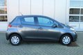 Toyota Yaris - 1.3 16v VVT-i 99pk 5D Now - 1 - Thumbnail