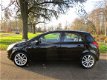 Opel Corsa - 1.2-16V Cosmo 5 deurs.airco.cruise control.electr.ramen.parkeer sensor.lm.wielen - 1 - Thumbnail