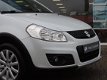 Suzuki SX4 - 1.6 Style - Nav | Climat | Stoelverw. | 4 seiz. banden - 1 - Thumbnail