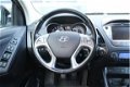 Hyundai ix35 - 1.6i GDi Business | Navigatie | Achteruitrijcamera | Climate control | Cruise control - 1 - Thumbnail