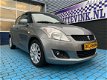 Suzuki Swift - 1.2 AUTOMAAT EXCLUSIVE AIRCO CRUISE PDC PARROT BOVAG - 1 - Thumbnail