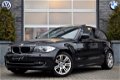 BMW 1-serie - 118I HIGH EXE. 5-DRS. AUT. NAVI SCH.DAK XENON - 1 - Thumbnail