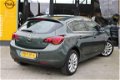 Opel Astra - 1.4i Turbo 140pk Cosmo Automatic | NAVI/ECC/Comfortstoelen - 1 - Thumbnail