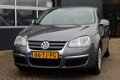 Volkswagen Jetta - 1.6 FSI (116pk) Airco/ Cruise/ Elek. pakket/ Armsteun/ Deelbare achterbank/ Isofi - 1 - Thumbnail
