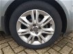 Opel Corsa - 1.4-16V Cosmo - AIRCO - CRUISECONTROLE - LM VELGEN - PARKEERSENSOREN ACHTER - 6 MAANDEN - 1 - Thumbnail