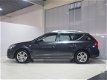 Kia Cee'd - 1.4 CVVT X-tra Navigatie + LM velgen - 1 - Thumbnail