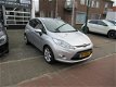 Ford Fiesta - 1.25 Ghia 54.000 KM, Climate control, Cruise control, L.M.Velgen, Parkeersensoren, Rad - 1 - Thumbnail