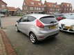 Ford Fiesta - 1.25 Ghia 54.000 KM, Climate control, Cruise control, L.M.Velgen, Parkeersensoren, Rad - 1 - Thumbnail