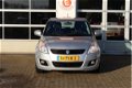 Suzuki Swift - 1.2 | Exclusive | Clima | Cruise | Keyless Entry | Bluetooth - 1 - Thumbnail