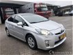 Toyota Prius - 1.8 hybride aut pano - premium - solardak - leer - nav - camera - bi xenon - head up - 1 - Thumbnail