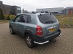 Hyundai Tucson - 2.7i V6 4WD Style 2.7 AUTOMAAT/AIRCO - 1 - Thumbnail