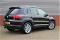 Volkswagen Tiguan - 1.4 TSI Sport&Style 150 PK Navi Cruise Park Assist El-wegklapbare Trekhaak Stoel - 1 - Thumbnail