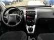 Hyundai Tucson - 2.0i Dynamic AC/Trekhaak/2WD/Ebony Black - 1 - Thumbnail
