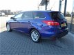 Ford Focus Wagon - 1.0 Titanium 125pk NAVI, Clima, PDC, stoel+stuur warming, - 1 - Thumbnail