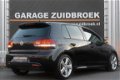 Volkswagen Golf - 1.4 TSI 122pk R-line HIGHLINE CLIMA PDC 4-deurs zwart - 1 - Thumbnail