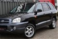 Hyundai Santa Fe - 2.4i 16V Elite 2006 Zwart Leer/Clima/Opendak/Cruise - 1 - Thumbnail