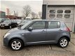 Suzuki Swift - 1.3 4Grip Exclusive Airco Elek. Pakket 5 Drs - 1 - Thumbnail